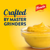 ["French's mustard in a bowl with the text 'Crafted by Master Grinders' on a yellow background."]