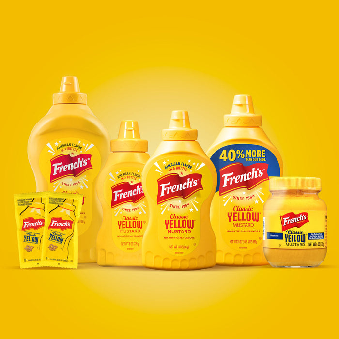 ["A variety of French's Classic Yellow Mustard bottles and packets."]