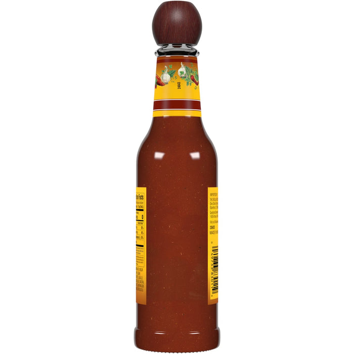 A bottle of Cholula Original Hot Sauce with a wooden top.