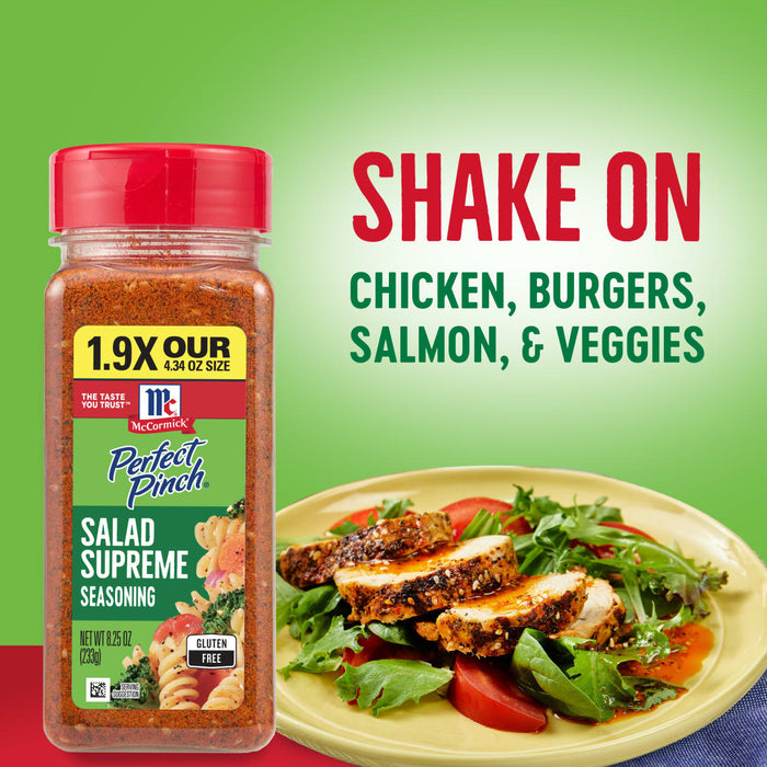 A jar of McCormick Perfect Pinch Salad Supreme Seasoning next to a plate of chicken salad.