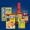 A variety of Old Bay products are displayed, including crab cake mix, seasoned coating mix, hot sauce, cocktail sauce, and seasoning.