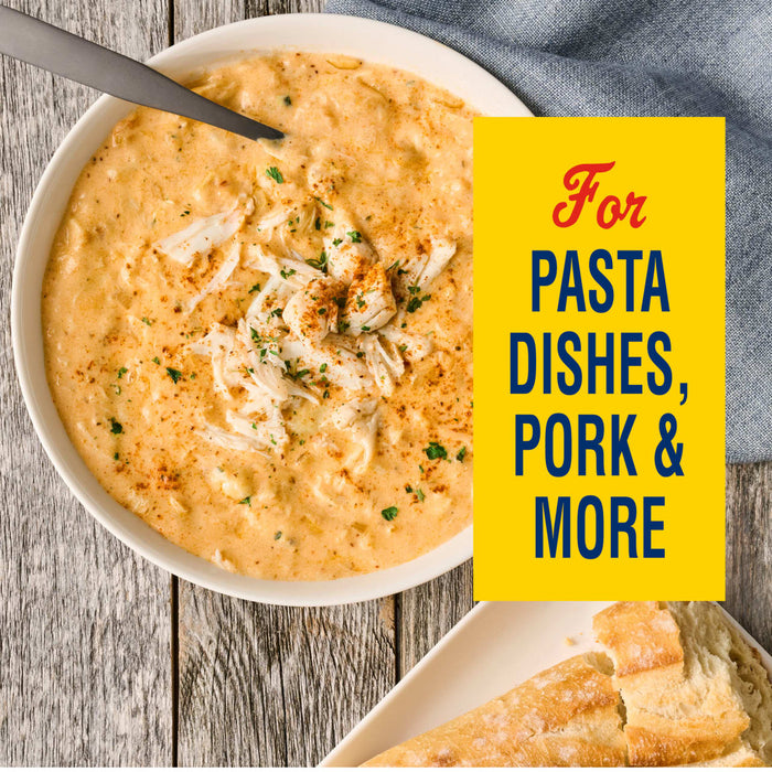 This image showcases a creamy dish, possibly crab bisque, with the text For PASTA DISHES, PORK &amp; MORE suggesting its versatility as a sauce or ingredient.