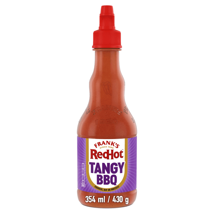 A bottle of Frank'S Redhot Franks Squeeze Tangy Bbq 354 Ml featuring a purple label and a red squeeze cap against a black background.