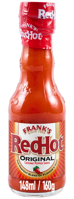 A full glass bottle of Franks Rdhot Orig Gb 24/148 Ml shows the iconic Frank's RedHot Original Cayenne Pepper Sauce label against a black background.