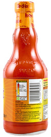 The back of a glass bottle of Frank's RedHot sauce, a product identified as Franks Rdhot Bws Gb 24/148 Ml, displays the ingredients, heat indicator, and McCormick company information.
