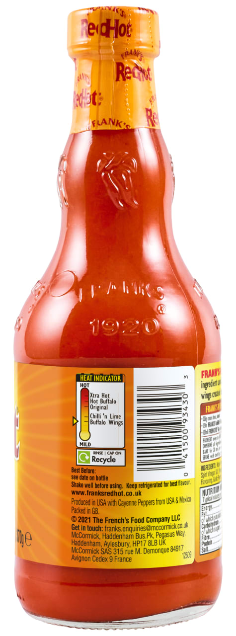 The back of a glass bottle of Frank's RedHot sauce, a product identified as Franks Rdhot Bws Gb 24/148 Ml, displays the ingredients, heat indicator, and McCormick company information.