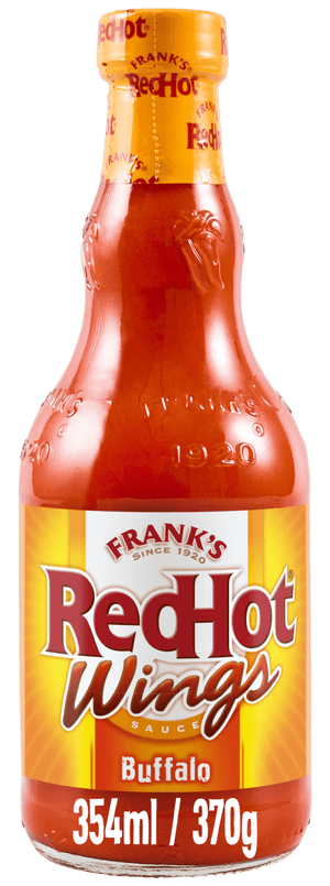 A glass bottle of Frank's RedHot Wings Buffalo Sauce, which is the product Franks Rdhot Bws Gb 24/148 Ml, is shown with its yellow and red label against a black background.