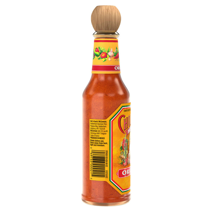 A side view of a bottle of Cholula Original Mexican Hot Sauce 150Ml, showing the back label with the barcode and McCormick contact information.