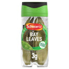 A clear plastic jar of Schwartz Bay Leaves 3G is shown against a white background, with a green and black lid.