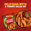 A packet of Schwartz Garlic And Herb Wedges, 38G is displayed next to a rustic bowl filled with seasoned potato wedges and a side of tomato salsa dip.