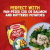A packet of Schwartz Creamy Parsley Sauce 26G is featured in an advertisement next to a serving suggestion of pan-fried cod with potatoes, peas, and asparagus.