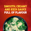 A serving suggestion shows fresh broccolini in a black bowl, generously covered with the smooth and creamy Schwartz Extra Mature Cheddar Cheese Sauce 30G.
