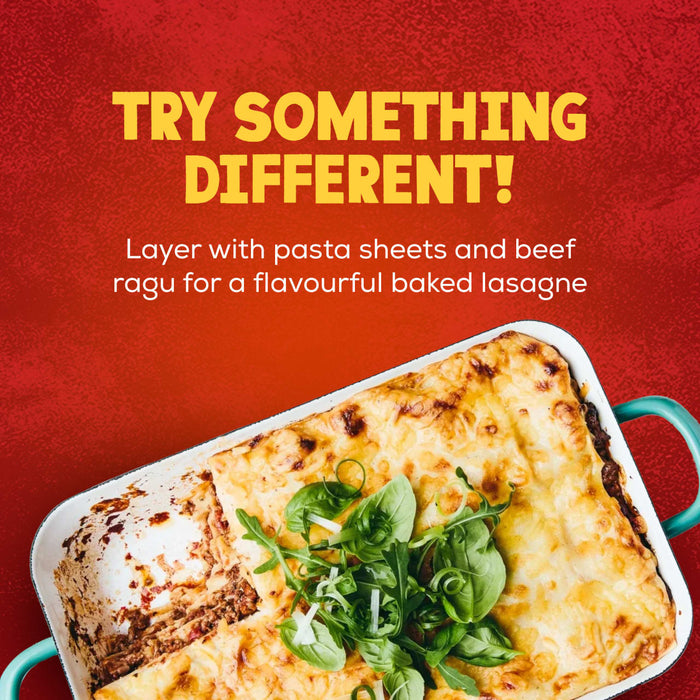 An enticing image of a freshly baked lasagna in a dish suggests trying something different by using Schwartz Extra Mature Cheddar Cheese Sauce 30G to create a flavourful meal.
