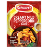 A packet of Schwartz Creamy Mild Peppercorn Sauce Mix 25G featuring a serving suggestion of steak with chips and peas.