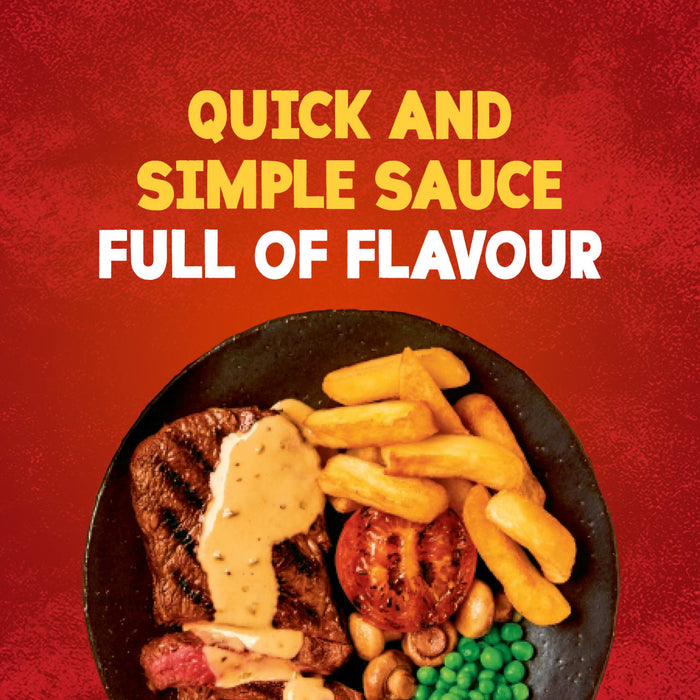 A serving suggestion for Schwartz Creamy Mild Peppercorn Sauce Mix 25G shows a grilled steak topped with the creamy sauce, served alongside chips, a grilled tomato, mushrooms, and peas.