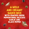 The key ingredients of green and black peppercorns and garlic cloves float around descriptive text for Schwartz Creamy Mild Peppercorn Sauce Mix 25G on a textured red background.