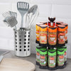 A two tier Spice Rack Engraved Gift Set featuring a variety of Schwartz spices including Cumin, Ginger, Mixed Spice, Basil, Mixed Herbs, and Sage on a kitchen counter next to a utensil holder.