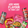 An advertisement on a pink background encourages shoppers to ADD MORE FLAVOUR TO YOUR CART, showcasing a variety of Schwartz products including a package of Schwartz Las Iguanas Bahian Coconut Curry 25G, Chilli Con Carne, and jars of spices.