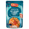 A 300g microwaveable pouch of Schwartz Forfish Dark Soy Sesame Ginger Sauce 300G featuring a serving suggestion of glazed salmon over a bed of noodles and vegetables.