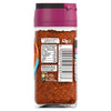 A back view of a glass jar containing Schwartz Paprika & Lemon Chicken Seasoning Reduced Salt 43G shows the nutritional information and recycling instructions on the label.