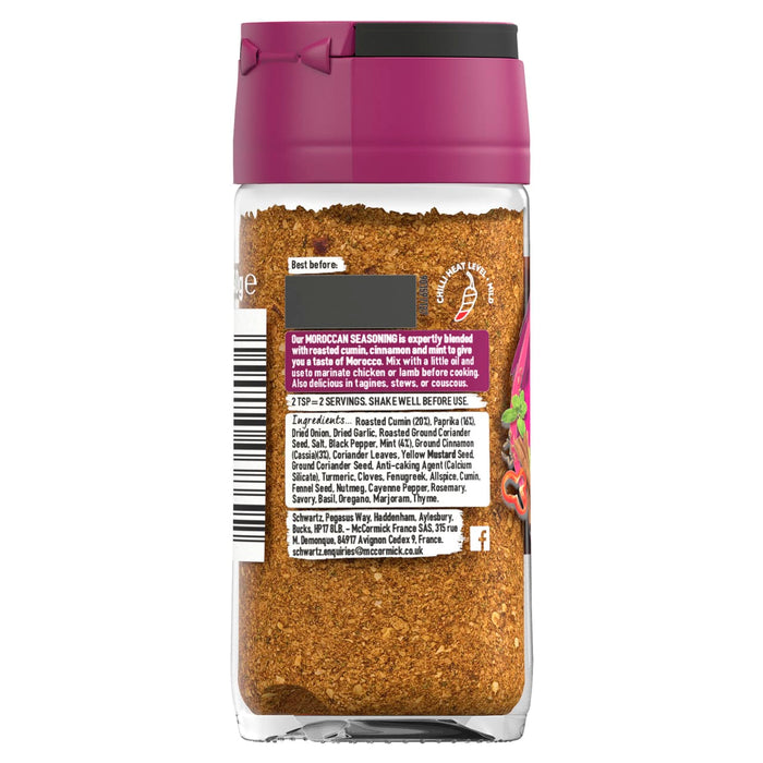 A back view of a glass jar of Schwartz Moroccan Seasoning 40G showing the ingredients list and a mild chili heat level indicator.