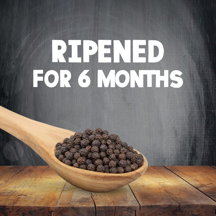 A wooden spoon filled with the high quality whole berries used in Schwartz Black Peppercorns Adjustable Medium Grinder 35G is shown against a dark background with text stating they are ripened for 6 months