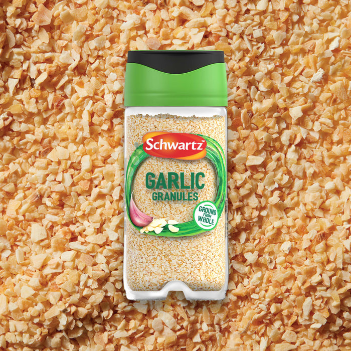 A clear jar of Schwartz Garlic Granules 50G is shown against a background of the same spice.