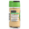 A back view of a glass jar of Schwartz Garlic Powder 55G showing usage tips and the conversion that one quarter teaspoon is equivalent to one fresh clove.