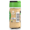 A clear glass jar of Schwartz Garlic Powder 55G showing the back label with a barcode and recycling information against a white background.