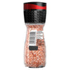 A clear glass grinder bottle of Schwartz Pink Himalayan Salt 71G shows the coarse pink salt crystals through the glass and includes a black and red adjustable grinding cap.