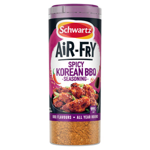 A clear shaker bottle of the Schwartz Af Sy Korean Seas seasoning, with a label that features a picture of spicy Korean BBQ chicken wings to show a serving suggestion.