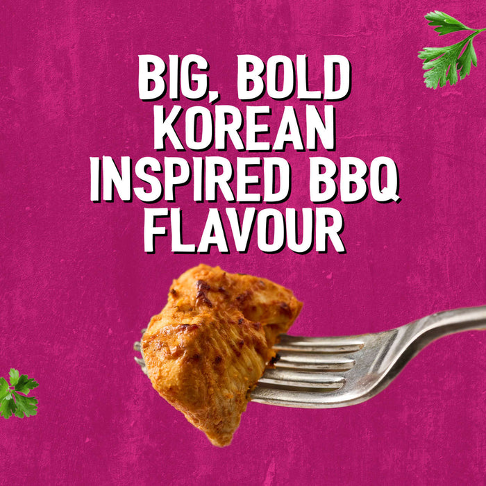 A piece of seasoned chicken on a fork highlights the big bold Korean inspired BBQ flavour of Schwartz Af Sy Korean Seas against a vibrant pink background.
