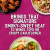 A vibrant food collage showcasing how Schwartz Af Sy Korean Seas brings that signature smoky-sweet heat to dishes like chicken wings, tofu bowls, and crispy cauliflower lettuce wraps.