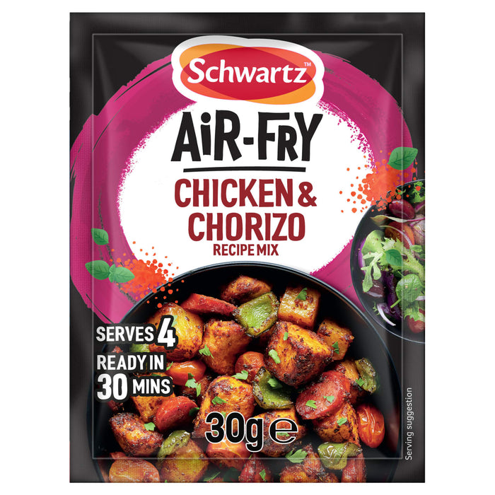 A Schwartz sachet of Sa Af Chorizo Chicken recipe mix is shown in front of a black bowl containing the finished dish of cooked chicken, chorizo, and vegetables.