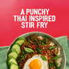 A bowl of Thai-inspired stir-fry with a fried egg and rice, demonstrating a delicious meal made with Sa Rt Chili Basil Stir Fry X12, is shown below the text A PUNCHY THAI INSPIRED STIR FRY.