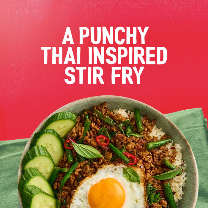 A bowl of Thai-inspired stir-fry with a fried egg and rice, demonstrating a delicious meal made with Sa Rt Chili Basil Stir Fry X12, is shown below the text A PUNCHY THAI INSPIRED STIR FRY.