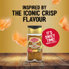 A bottle of Jr Thai Sweet Chil Seas X6 by Schwartz is displayed on a wooden surface against a gold background with floating crisps to highlight its sweet and spicy flavor profile.