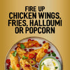 A plate of seasoned halloumi fries garnished with pomegranate seeds and chili peppers highlights the versatility of the Jr Hot Honey Seas X6 seasoning.