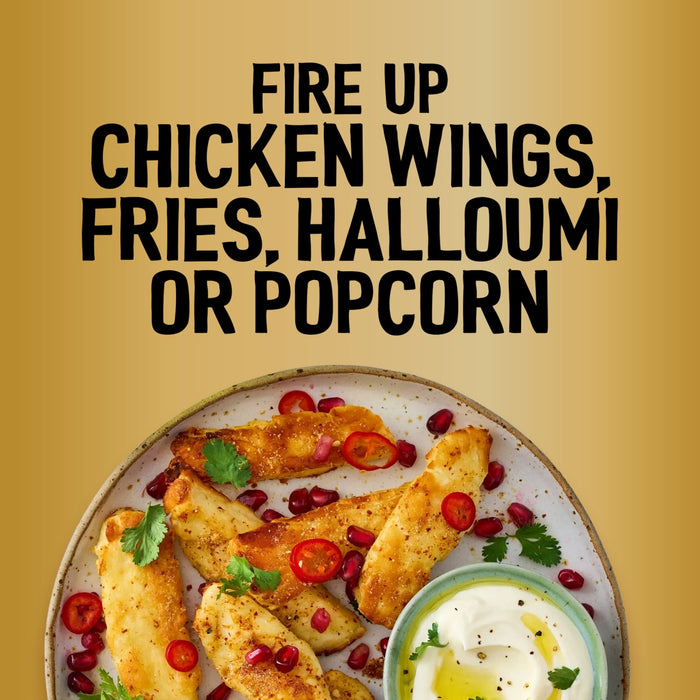 A plate of seasoned halloumi fries garnished with pomegranate seeds and chili peppers highlights the versatility of the Jr Hot Honey Seas X6 seasoning.