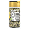 The back of a glass jar of Schwartz Jr Every Bagel Seas X6, showing the nutritional information, barcode, and recycling instructions against the backdrop of the seasoning mix.