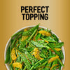 A vibrant salad of green beans and snap peas garnished with orange segments and a generous sprinkle of Jr Every Bagel Seas X6 under the text Perfect Topping.
