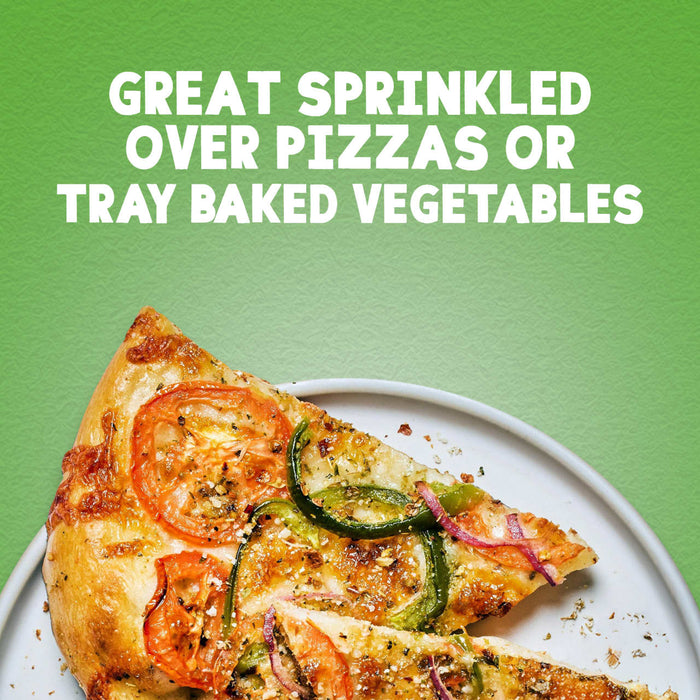 A slice of vegetable pizza seasoned with Schwartz Basil 10G is presented on a plate against a green background with text suggesting it is great for pizzas or tray baked vegetables.