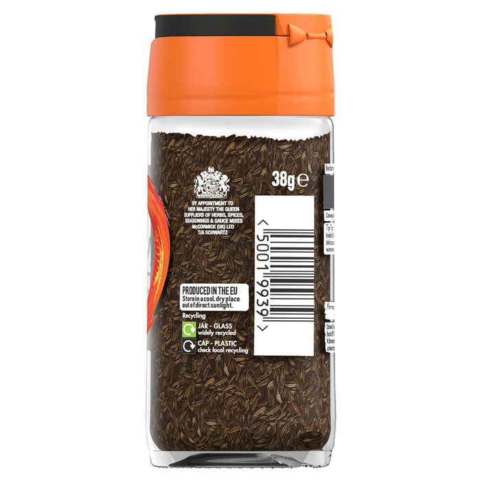 A clear glass jar of Schwartz Caraway Seeds 38G showing the dark brown seeds through the label which features the Royal Warrant and recycling information.