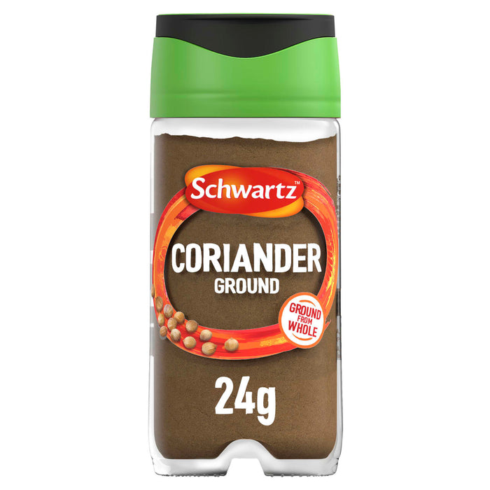 A clear glass jar of Schwartz Ground Coriander, 24G features a green lid and a label showing whole coriander seeds and the fine brown spice powder inside.