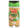 A clear glass Schwartz Minced Garlic 46G Jar with a green and black lid filled with dried garlic pieces and featuring a label with two garlic cloves.