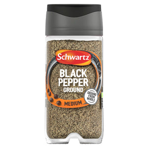 A clear glass jar of Schwartz Black Pepper Ground Medium with a dark grey lid and an orange label.