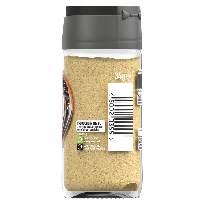 A clear glass jar of Schwartz Ground White Pepper 34G shows the fine tan powder inside along with recycling information and storage instructions on the label.
