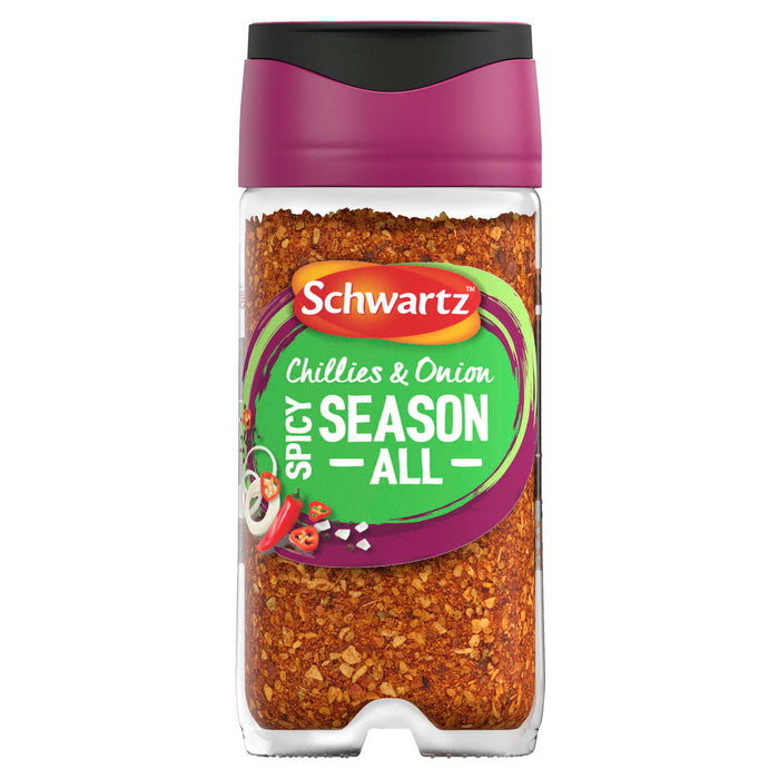 A clear glass jar of Schwartz Chillies & Onion Spicy Season All, 47G features a vibrant green and purple label with illustrations of fresh red chillies and onion rings.