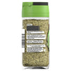 A clear glass jar of Schwartz Herbes De Provence, 11G shows a blend of dried herbs including rosemary, savory, marjoram, oregano, basil, and thyme through the back label.