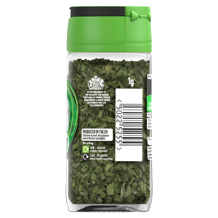 A clear glass jar of Schwartz Chives, 1G shows the dried green herbs through the glass and features a green cap and a label with recycling information.